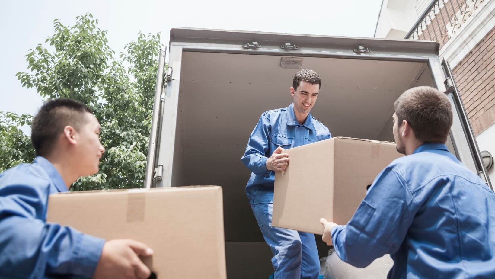 Workers moving boxes