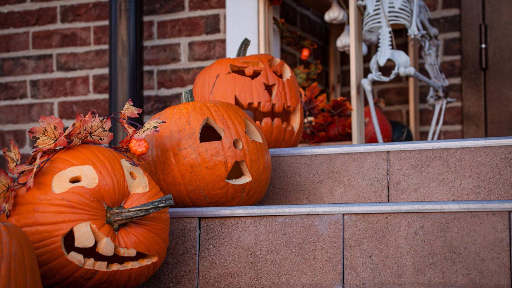 carved pumpkins on steps