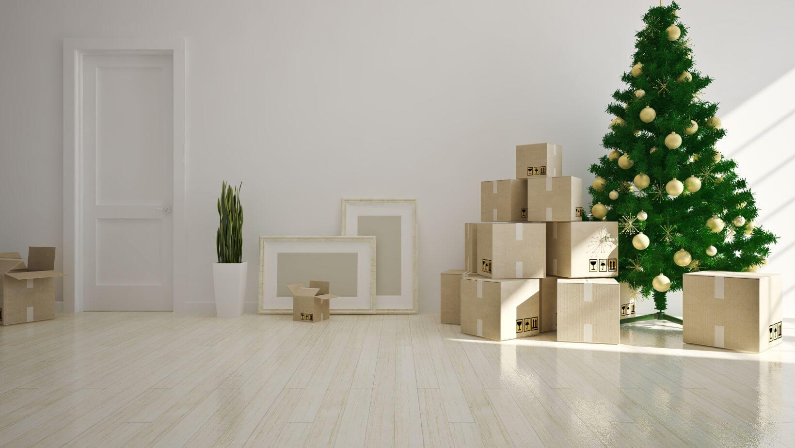 moving boxes beside the Christmas tree